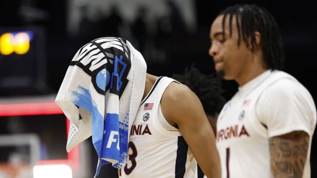 Virginia Cavaliers guard Ryan Dunn leaves the court after being defeated by the Colorado State Rams.